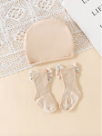chaussettes bébé antidérapantes, turban bébé coton, ensemble bébé élégant, cadeau bébé spécial, accessoires bébé mode, tenue bébé quotidienne, chaussettes nœud floral, turban doux bébé, confort bébé, sécurité bébé, style bébé