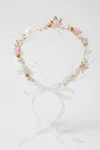 Serre-tête rose à fleurs et perles, détail en gros plan, serre-tête de cérémonie raffiné
