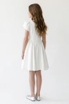 Robe Rumi blanche vue de dos – couture de taille en pointe et jupe froncée
