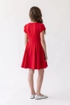 Robe Rumi rouge vue de dos – fermeture éclair et jupe froncée sur les côtés